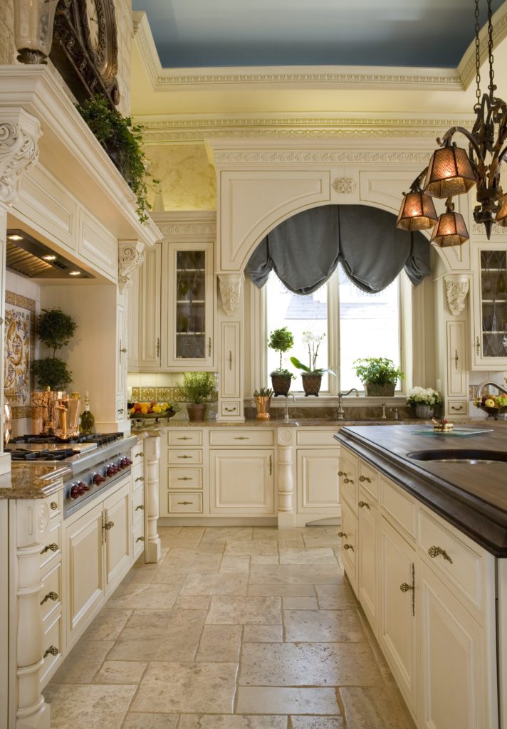 Kitchen with custom cabinetry and kitchen island with Butcher block countertop