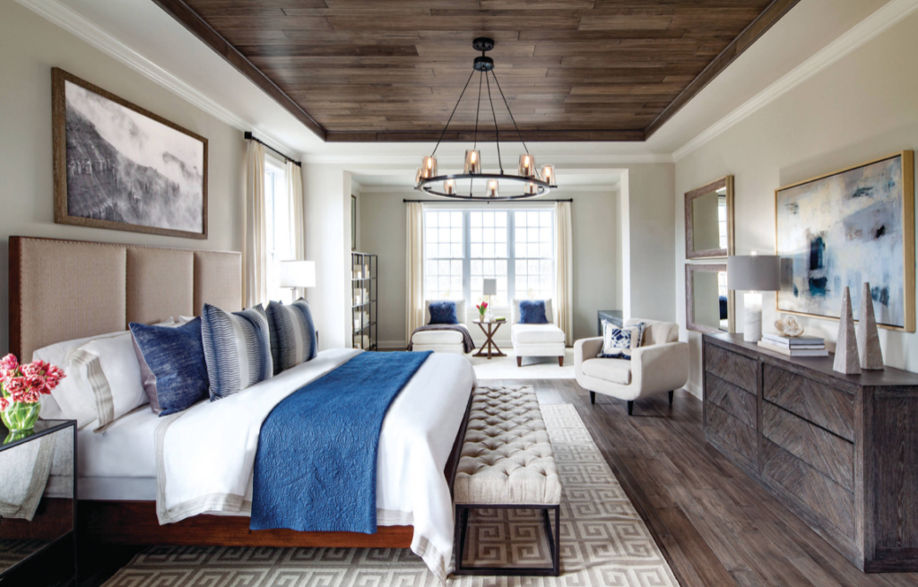 Master Bedroom with Blue and White tones and wood pannel ceiling