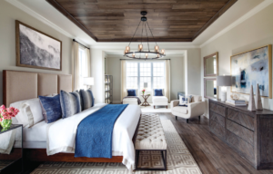 Master Bedroom with Blue and White tones and wood pannel ceiling