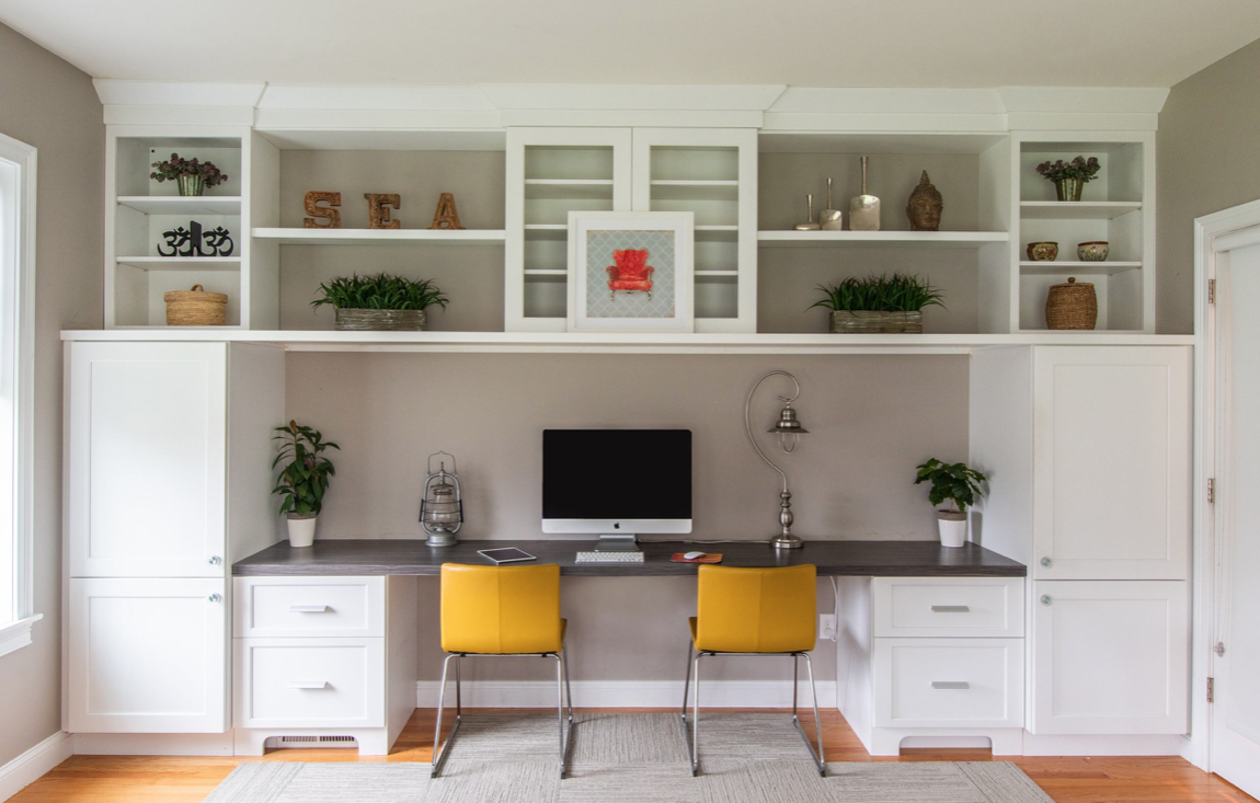 Home office built-in cabinets with two chairs