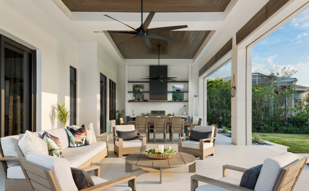 Outdoor living room with entertainment center, dining table and fan