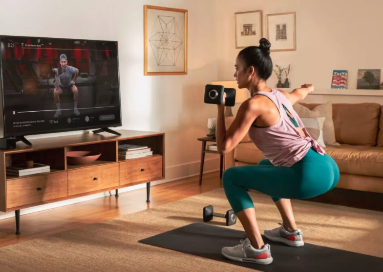 Woman exercising in her living room
